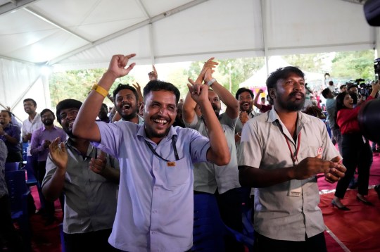 ISRO staff celebrate the successful landing