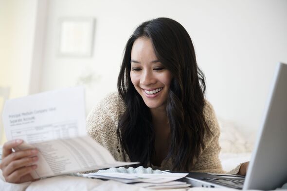 A woman checks her bills