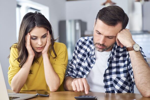 A couple check their bills