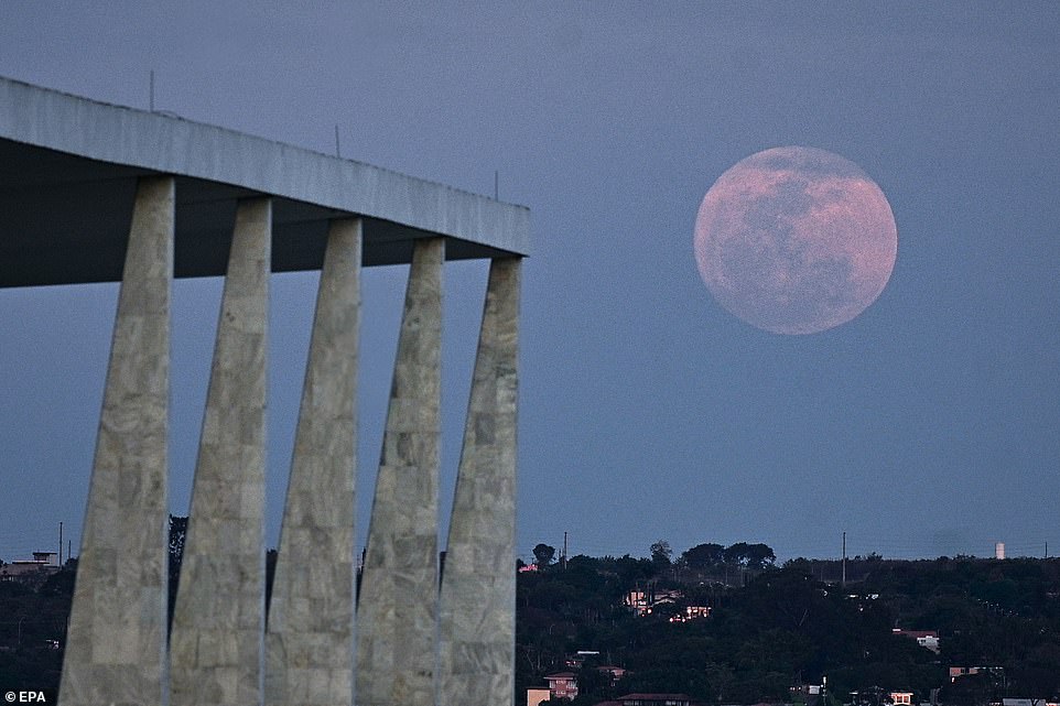 BRAZIL: The super blue moon crosses the sky next to the columns of the Palacio do Planalto in Brazil