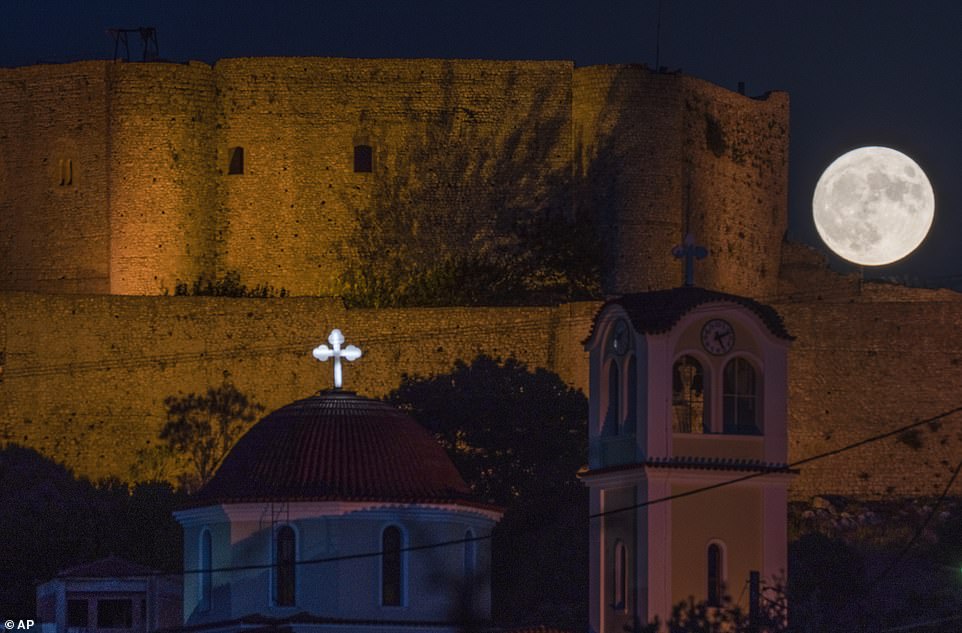GREECE: The supermoon rises behind the Chlemoutsi medival castle in Kyllini, Peloponnese, Greece
