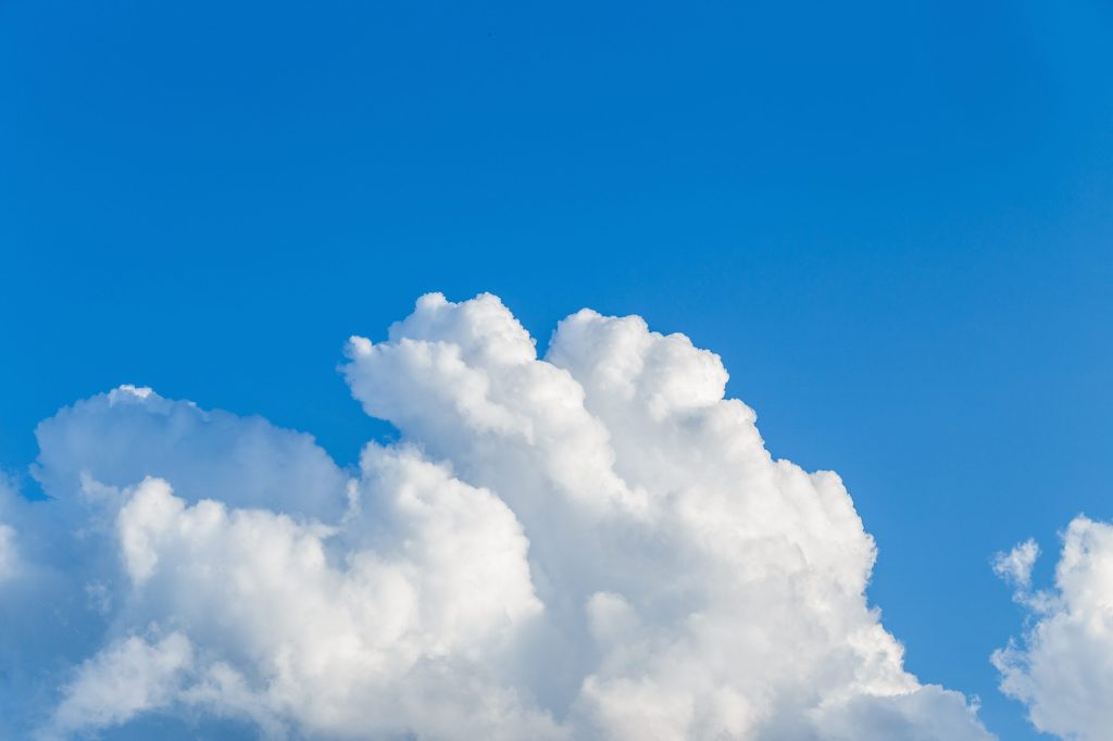 puffy white clouds in a blue sky