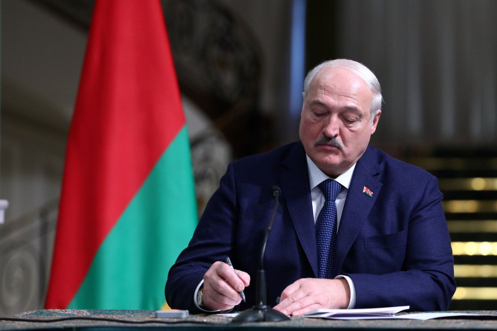 resident of Belarus Aleksandr Lukashenko and the Iranian President Ebrahim Raisi (not seen) sign an agreement in Tehran, Iran on March 13, 2023