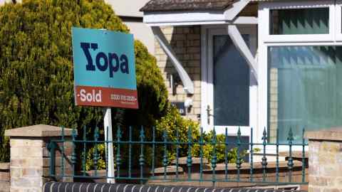 An estate agent’s sign outside a house in Cambridge