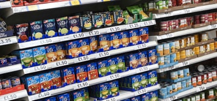 Packet and tinned food on supermarket shelves