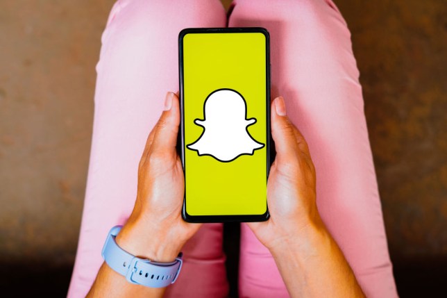 In this photo illustration, the Snapchat logo is displayed