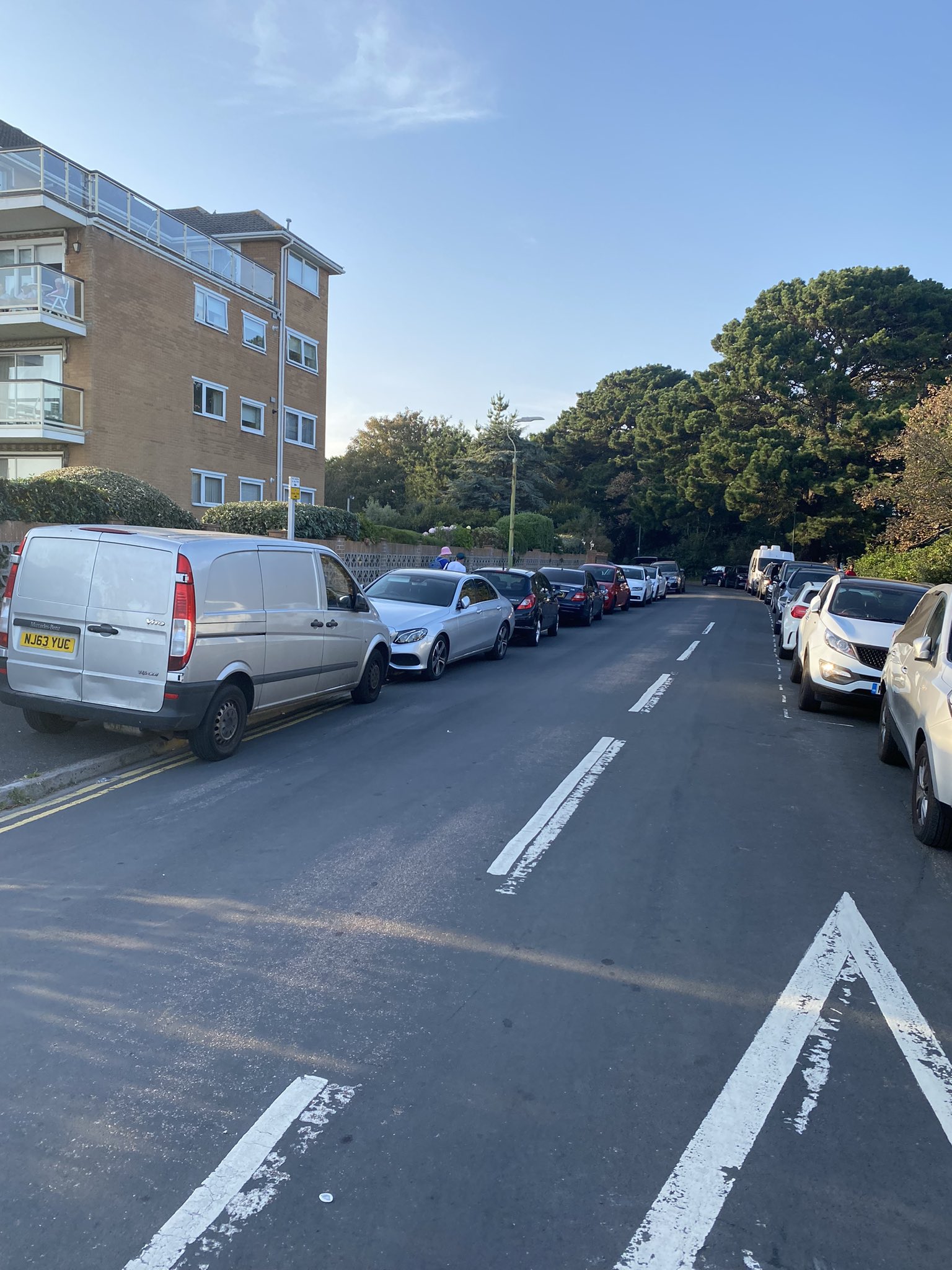 Double parking on a road near the beach