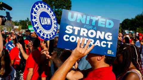 UAW members and others gather for a rally after marching in the Detroit Labor Day Parade on September 4 in Detroit, Michigan