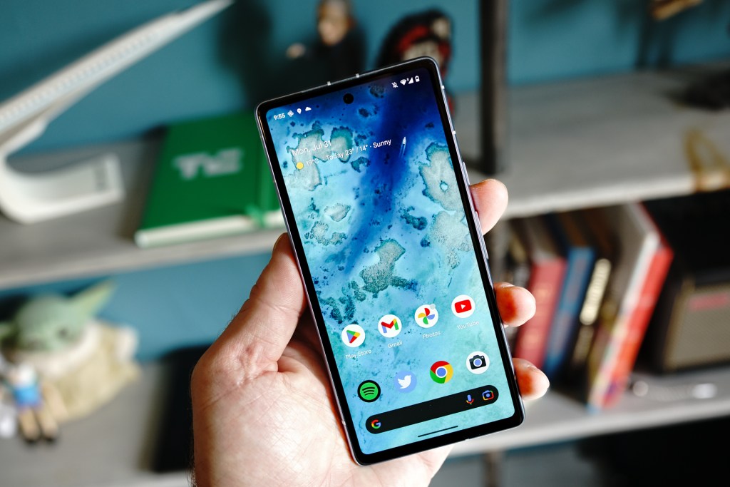 Google Pixel 7a smartphone held in a hand