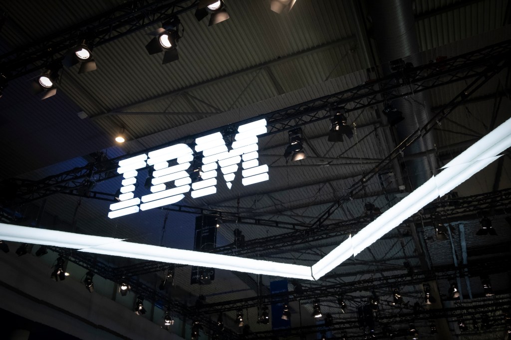 an IBM logo lit up on a dark background