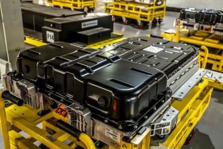 Batteries being carried by robots across factory floor