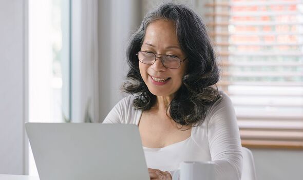 A woman checks her finances