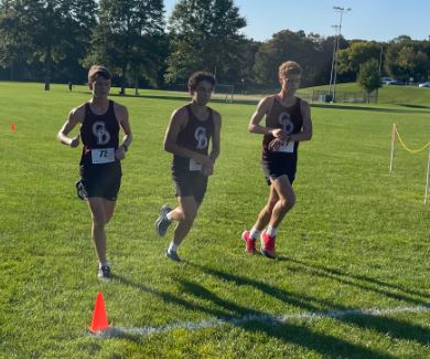 Groton-Dunstable runners, from left, Greyson Duane, Neil Aradhya and Zak Metzger cross in first place together during a boys cross country meet Tuesday. The Crusaders (6-0) defeated Marlboro, 17-46. (Courtesy photo)