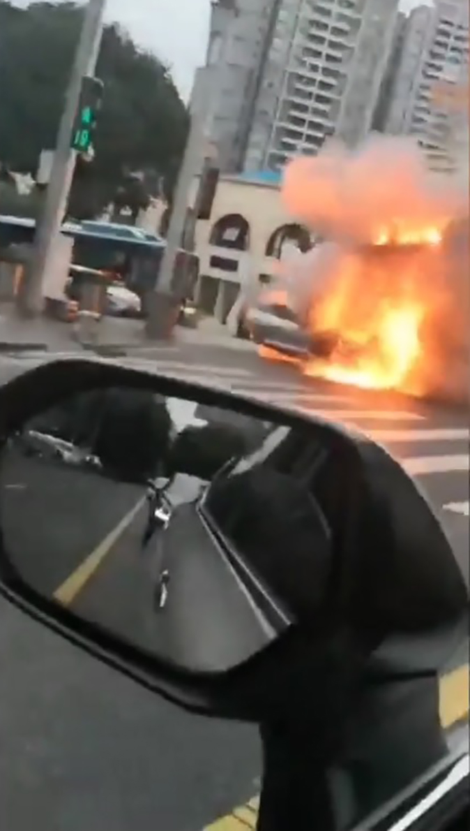 Stunned drivers watched as the EV erupted into a fireball