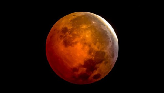 Low angle view of moon against sky at night