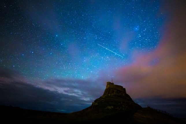 A meteor shower lighting up the sky when space dust and debris burns up in the atmosphere, amid Draconid meteor shower 2023