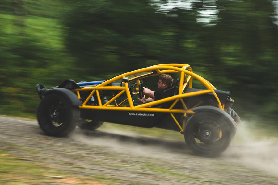 Ariel Nomad sliding through corner – side