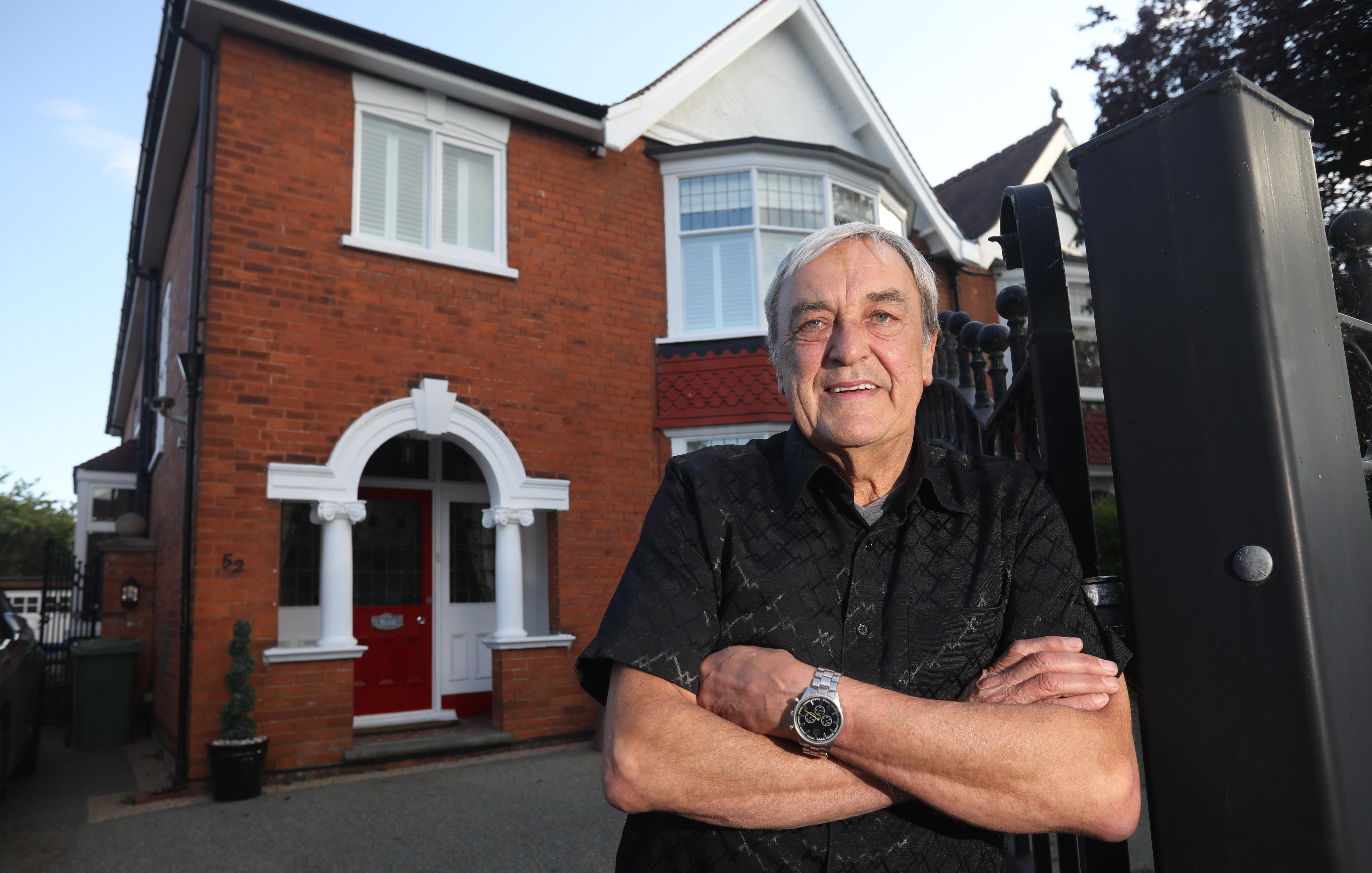 Roy outside his £300,000 semi in Grimsby