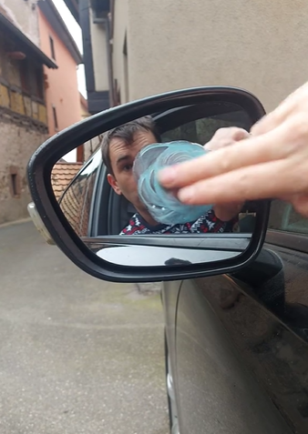 The TikTok user rubs toothpaste over his mirror