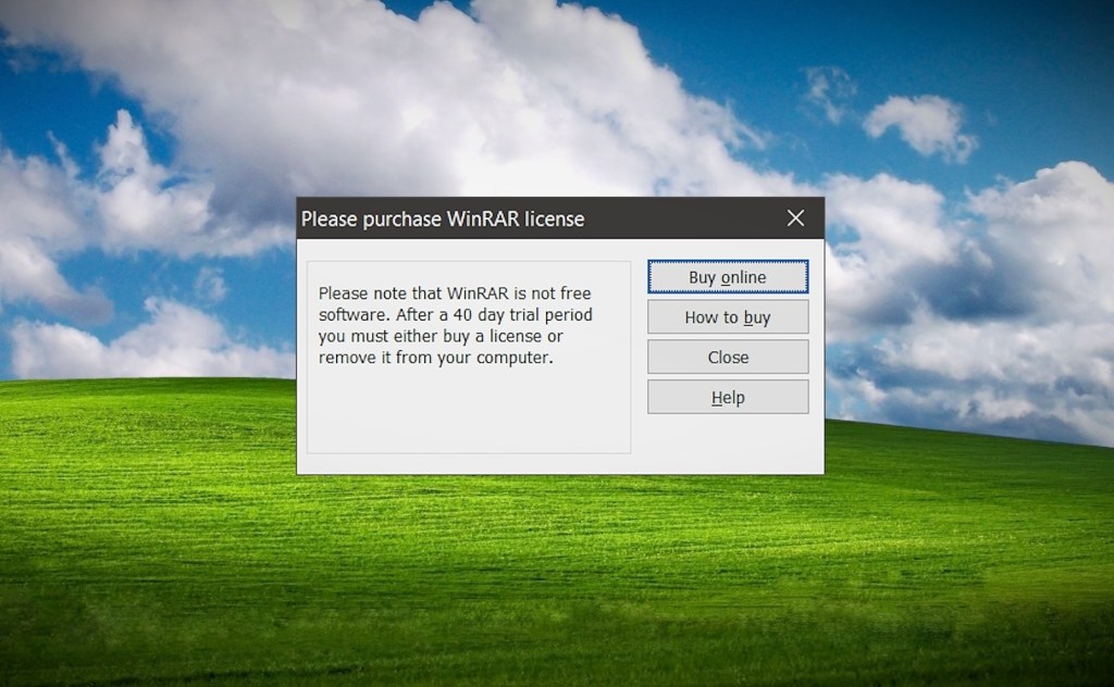 a WinRAR popup asking users to purchase the shareware archiving tool, on a Windows background from a decade ago