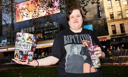 Sam Stacey awaits the first screening of ‘Taylor Swift: The Eras Tour’, outside Odeon Leicester Square in London.