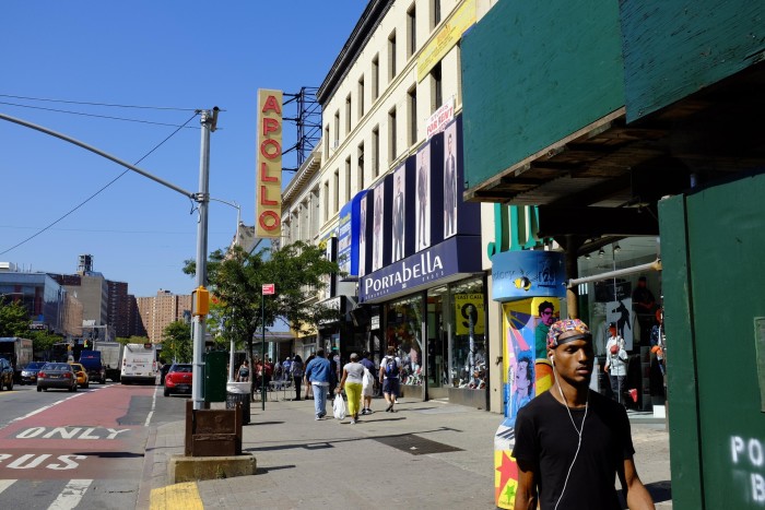 Harlem street with the Apollo Theater and pedestrians