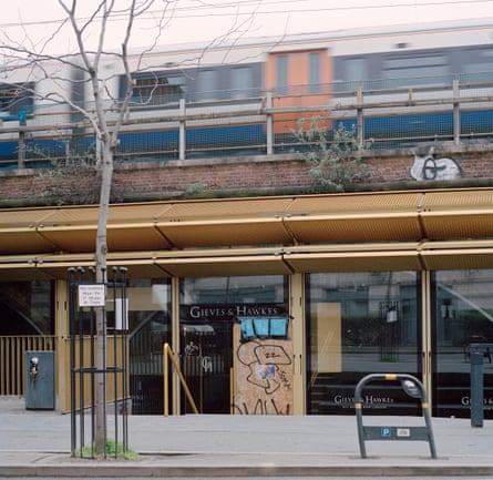 The boarded up shopfront of a Gieves & Hawkes store in Hackney Walk, east London