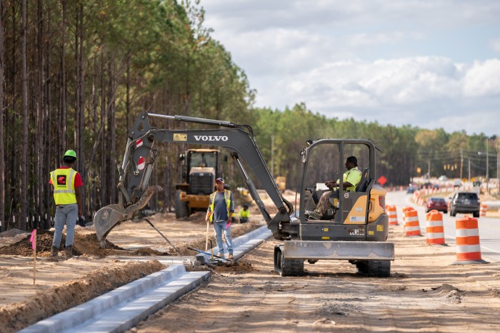 Work on a road widening project near the planned Scout Motors facility in Blythewood 