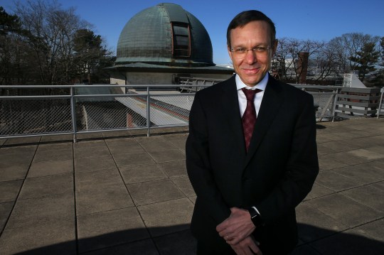 Professor Avi Loeb stood on the roof of an observatory.