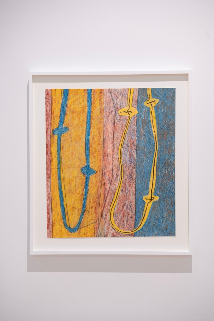 An abstract image in oil pastel showing blue and yellow squiggles over a yellow, pink and blue background 
