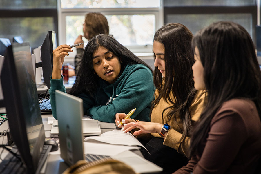 Northwest students discuss a task during a software engineering principles course. (Photo by Lauren Adams/Northwest Missouri State Unversity)