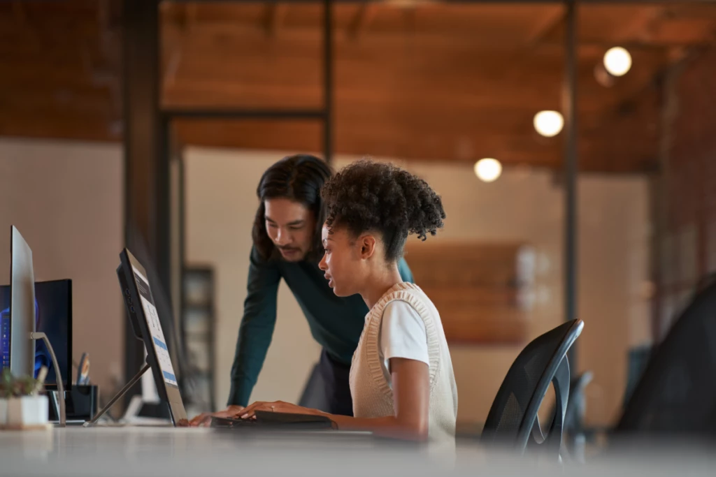 Enterprise office workers collaborating in an open work space.