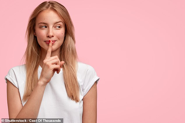 Keeping secrets – at least for a little while – could actually brighten your day, according to new research (stock image)