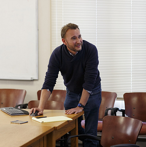 Scott Shackelford stands at a table