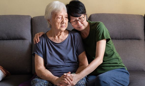 Elderly woman hugging