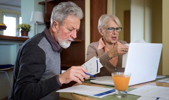 A couple check their bills