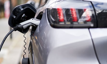 a silver electric car charging