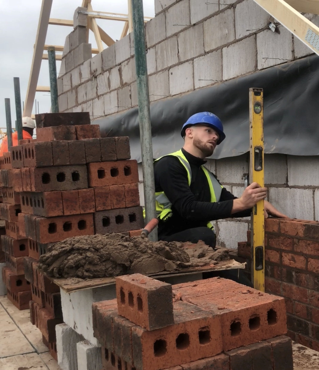 The 26-year-old bricklaying on a building site
