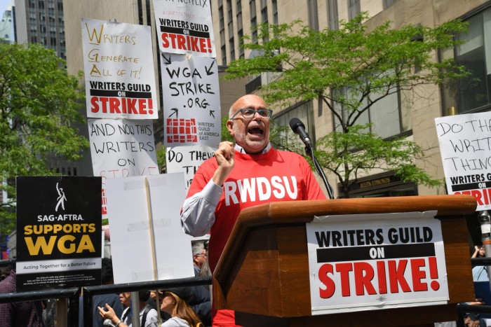 Stuart Appelbaum, of the Retail, Wholesale and Department Store Union, speaks at a Writers Guild of America rally in New York