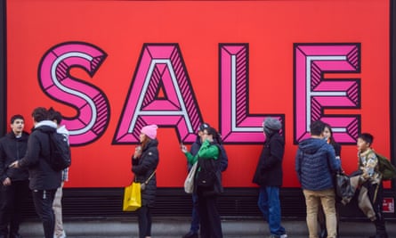 Customers queue outside Selfridges on Oxford Street as Boxing Day sales begin.