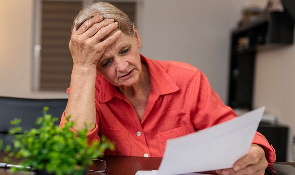 A woman checks her finances