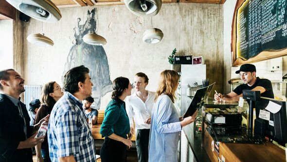 People queue in cafe