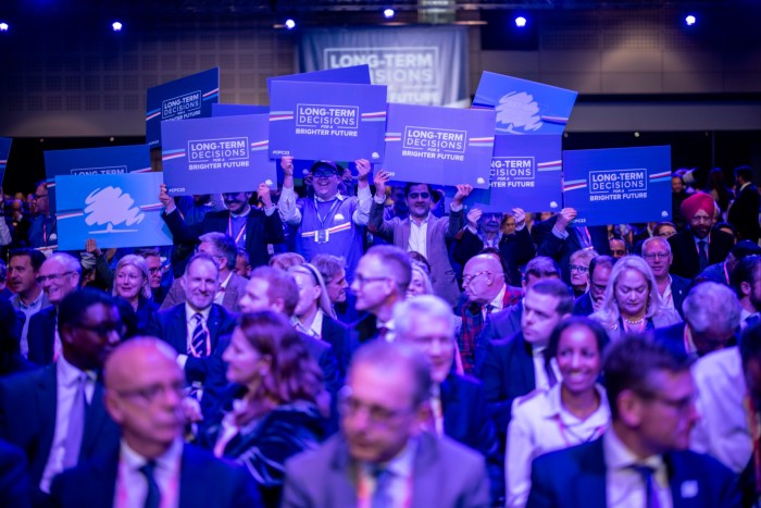 Delegates wait for Rishi Sunak at the Tory conference in Manchester, where his announcement that he was scrapping a high-speed rail line to the city baffled many of his MPs