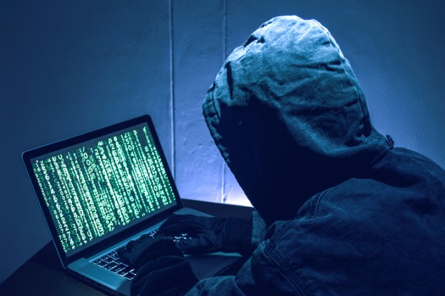 Hacker stealing passwords and identity, computer crime