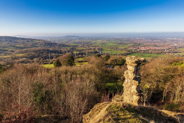 natural rock structure resembling a chimney on a hilltop