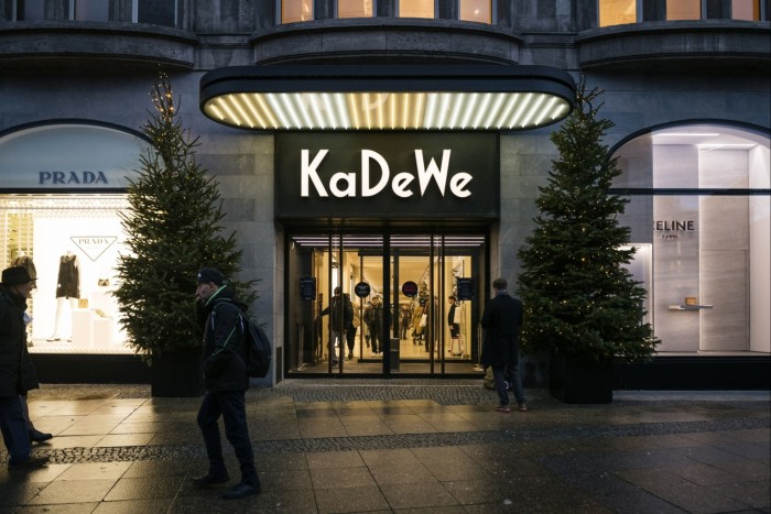 Christmas trees outside an entrance to the KaDeWe department store in Berlin