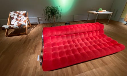 A red Impala sofa by designer Gillis Lundgren 