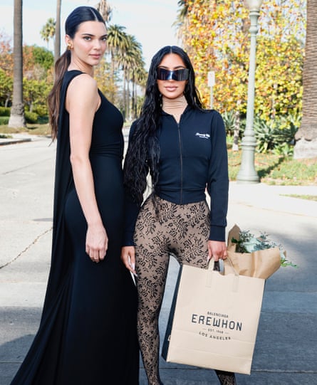 Kendall Jenner and Kim Kardashian attend the Balenciaga Fall 24 Show on 2 December 2023 in Los Angeles, California