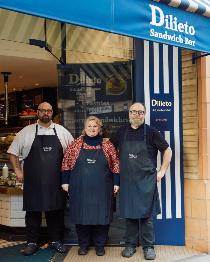 Dilieto owners Jesus, Maria Chony and Alberto Rubiera Iglesias standing outside the shop