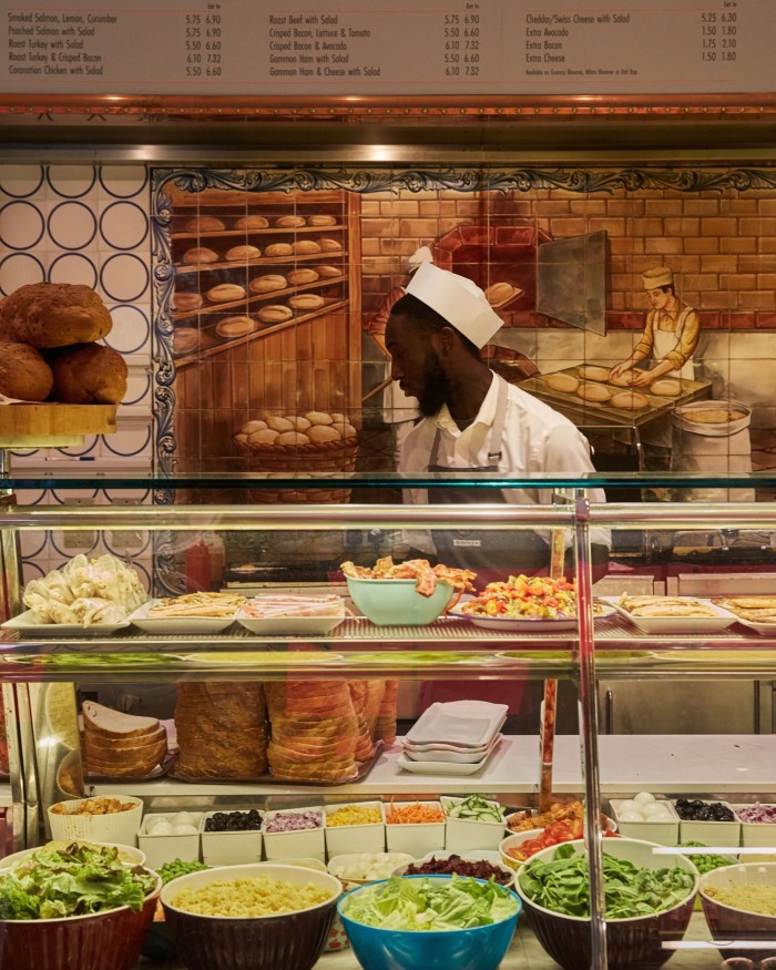 An employee behind the counter of Birleys